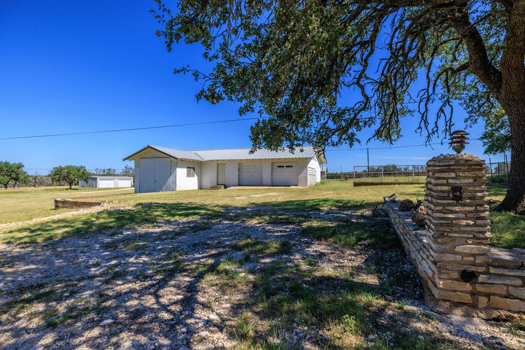 315 Rieger Road Harper, TX 78631 - Photo 18 of 30 a view of a house with a yard