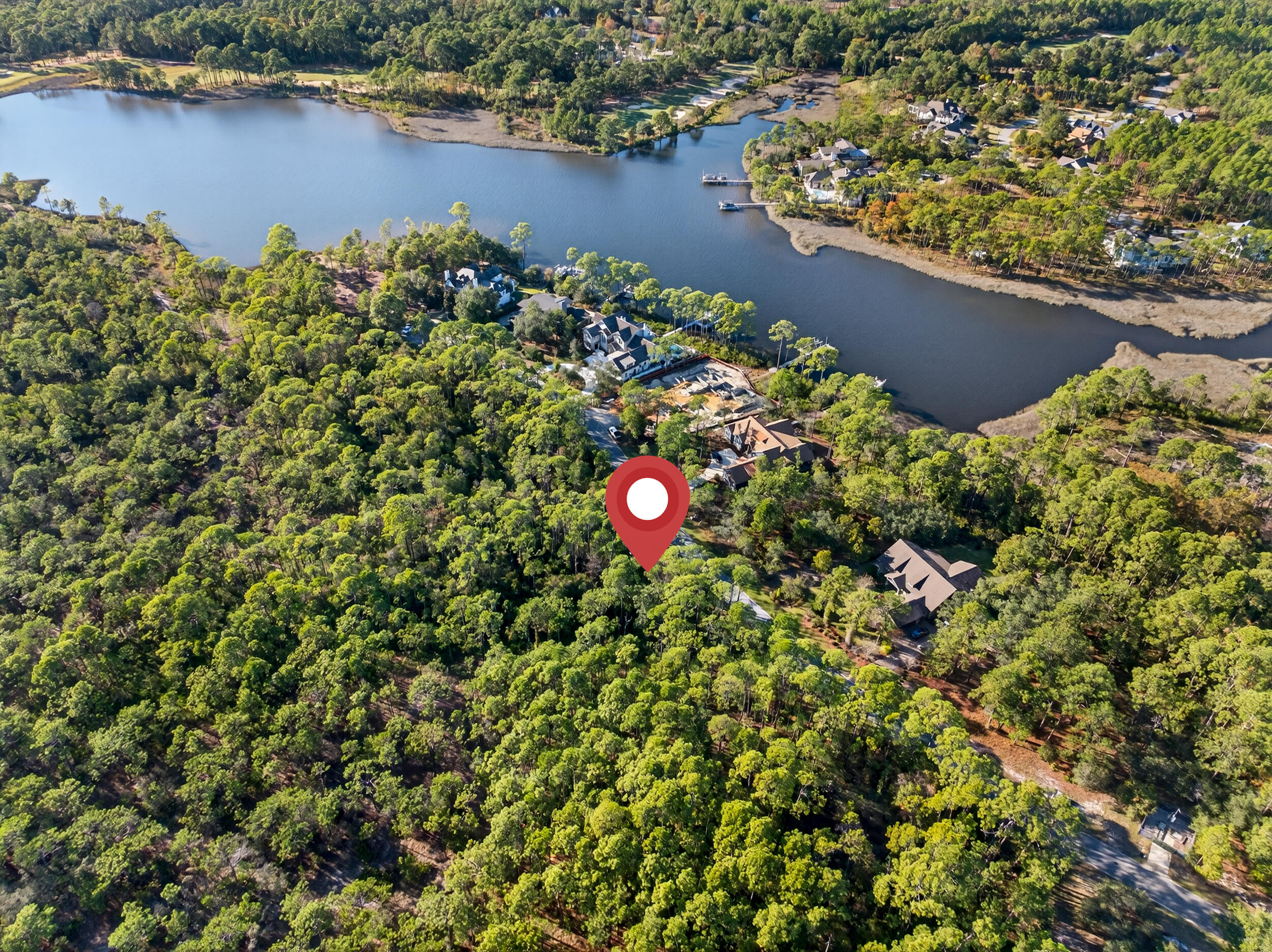22113 Marsh Rabbit Run Panama City Beach, FL 32413 - Photo 11 of 23 an aerial view of a house with a yard and lake view
