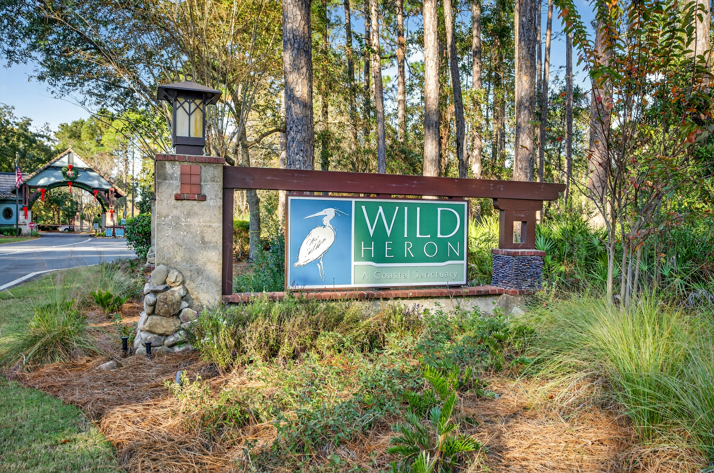22113 Marsh Rabbit Run Panama City Beach, FL 32413 - Photo 17 of 23 front view of a house with a yard