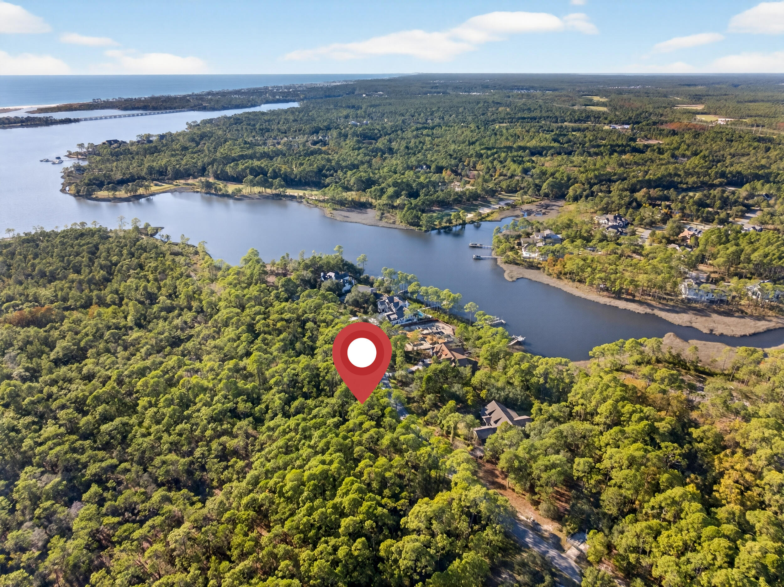 22113 Marsh Rabbit Run Panama City Beach, FL 32413 - Photo 10 of 23 an aerial view of a house with a lake view