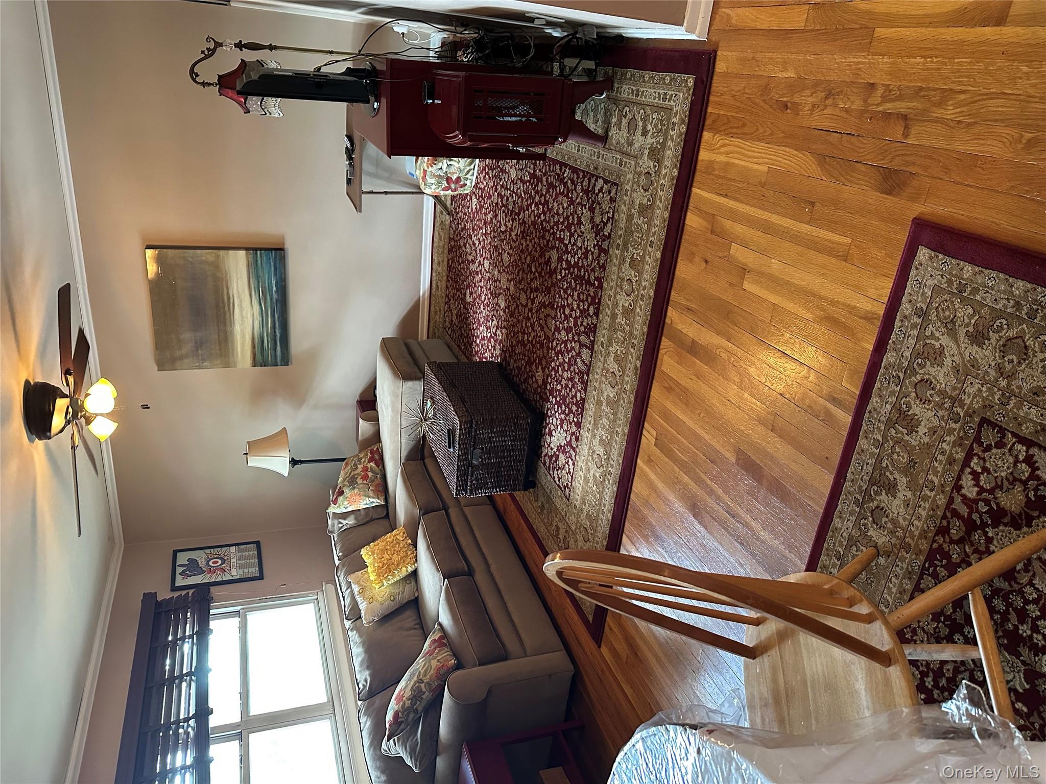 81-49 268th Street, Unit 290B Queens, NY 11004 - Photo 2 of 9 a living room with furniture