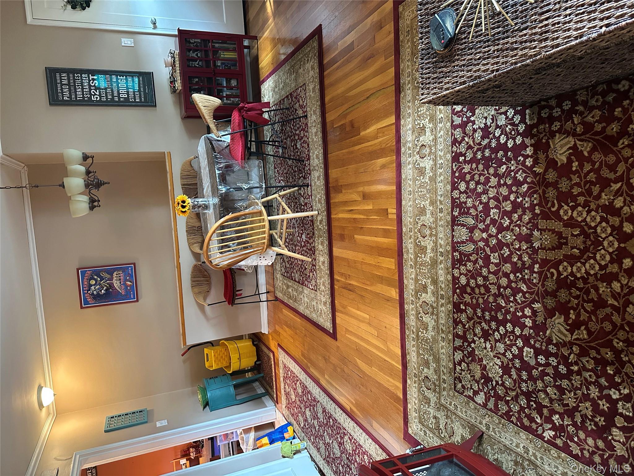 81-49 268th Street, Unit 290B Queens, NY 11004 - Photo 4 of 9 a bedroom with bed and wooden floor