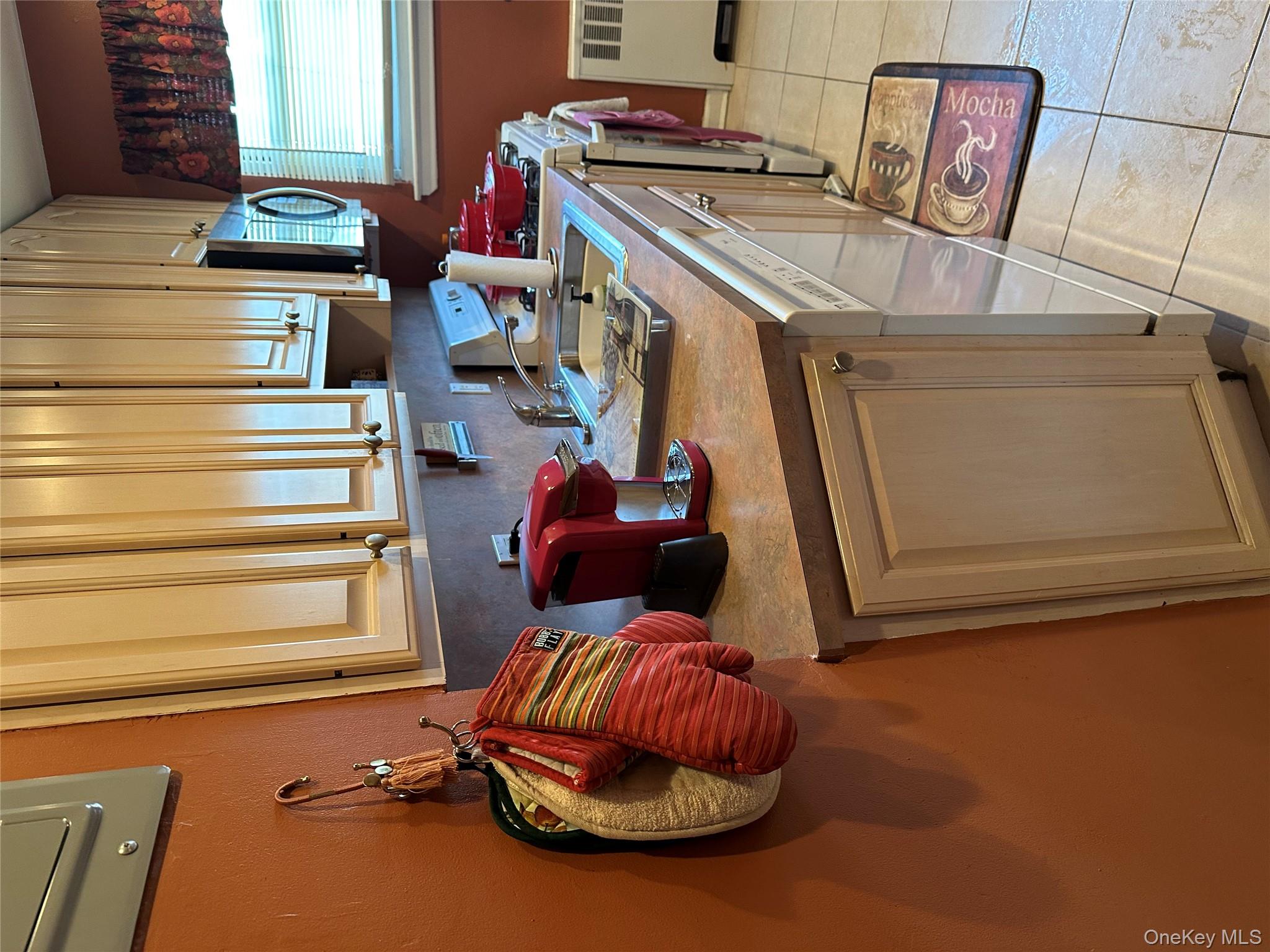 81-49 268th Street, Unit 290B Queens, NY 11004 - Photo 6 of 9 a kitchen with a sink cabinets and a window