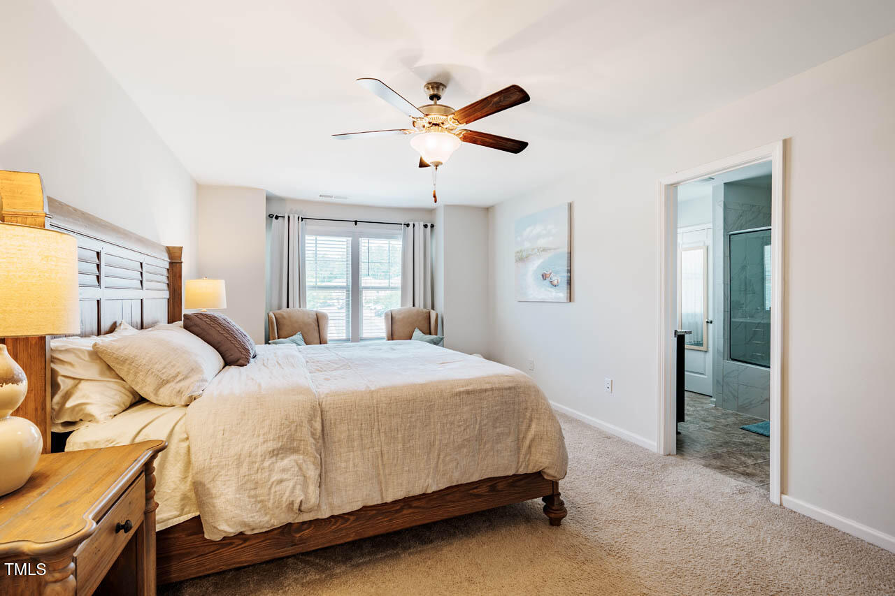 1101 Compass Drive Durham, NC 27713 - Photo 13 of 32 a bedroom with a bed and window