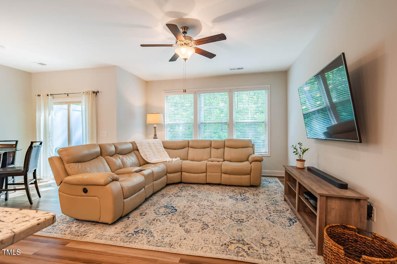 1101 Compass Drive Durham, NC 27713 - Photo 14 of 32 a living room with furniture and a flat screen tv