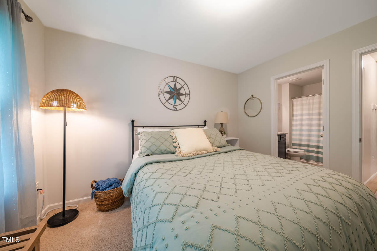 1101 Compass Drive Durham, NC 27713 - Photo 20 of 32 a bedroom with a bed and a window