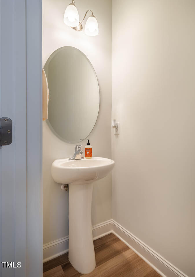 1101 Compass Drive Durham, NC 27713 - Photo 24 of 32 a bathroom with a sink and mirror