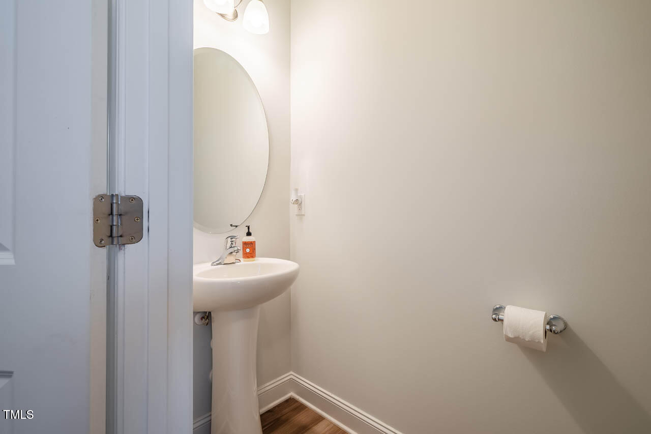1101 Compass Drive Durham, NC 27713 - Photo 25 of 32 a bathroom with a sink and mirror