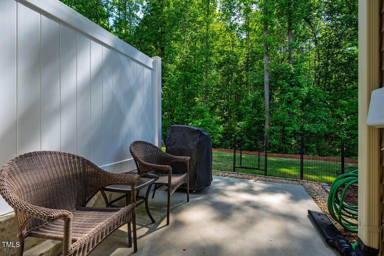 1101 Compass Drive Durham, NC 27713 - Photo 26 of 32 a view of backyard with outdoor seating and green space