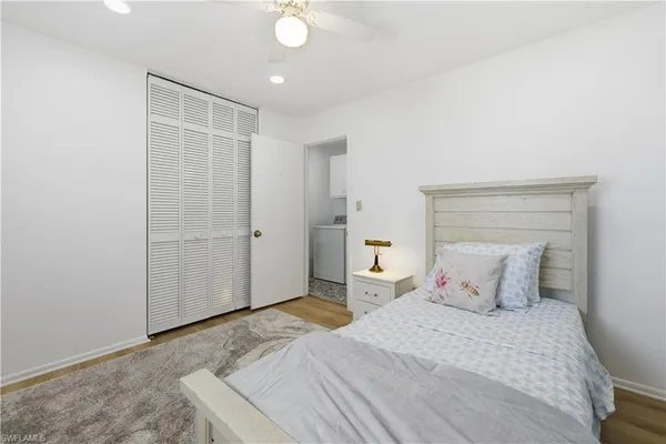 a bedroom with a bed and cabinets
