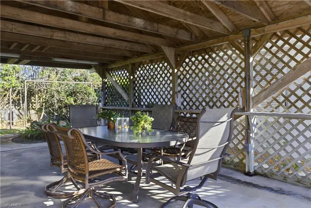 a patio with table and chairs