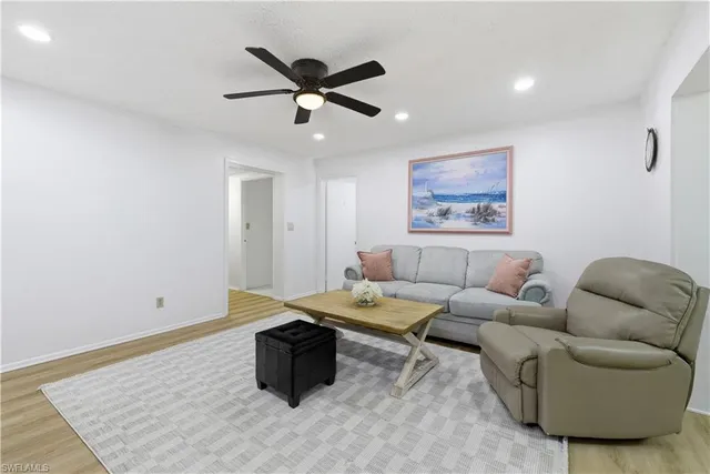 a living room with furniture and a rug