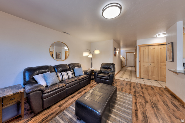 3461 Westwater Road, Unit 6 Moab, UT 84532 - Photo 9 of 33 Living area featuring light wood finished floors and stairway