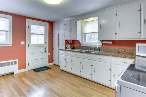 35 Woodland Road Wayland, MA 01778 - Photo 11 of 30 a kitchen with cabinets appliances and a window