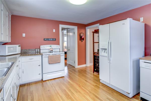 35 Woodland Road Wayland, MA 01778 - Photo 12 of 30 a kitchen with white cabinets and white appliances
