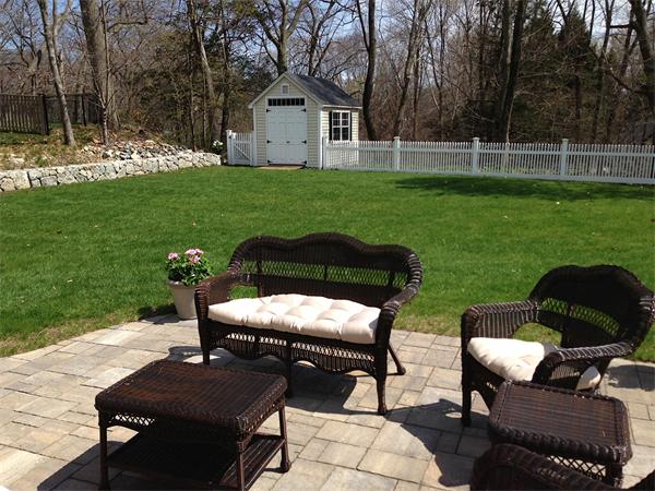 35 Woodland Road Wayland, MA 01778 - Photo 29 of 30 a backyard of a house with table and chairs