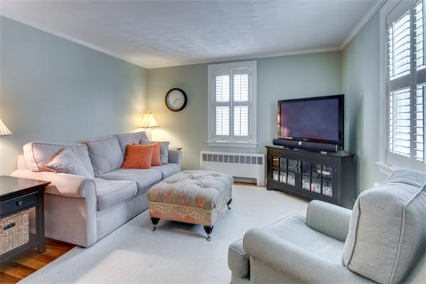 35 Woodland Road Wayland, MA 01778 - Photo 5 of 30 a bedroom with furniture a bed and a flat screen tv