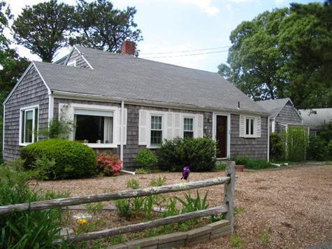 28 Manderville Road West Harwich, MA 02671 - Photo 1 of 18 a front view of house with yard and green space