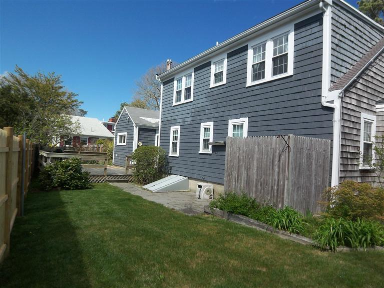 28 Manderville Road West Harwich, MA 02671 - Photo 13 of 18 a front view of a house with a yard and green space