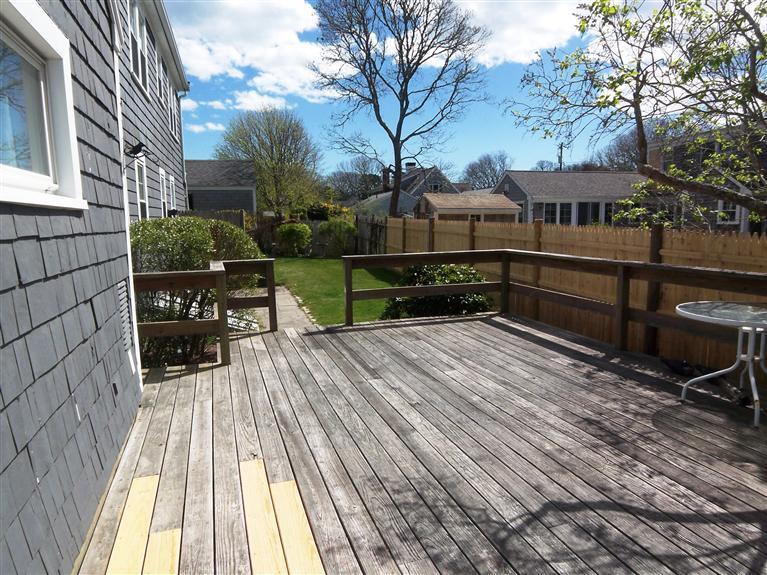 28 Manderville Road West Harwich, MA 02671 - Photo 15 of 18 a view of a house with backyard and sitting area
