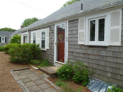 28 Manderville Road West Harwich, MA 02671 - Photo 16 of 18 a front view of a house with garden