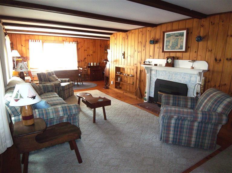 28 Manderville Road West Harwich, MA 02671 - Photo 4 of 18 a living room with furniture and a fireplace