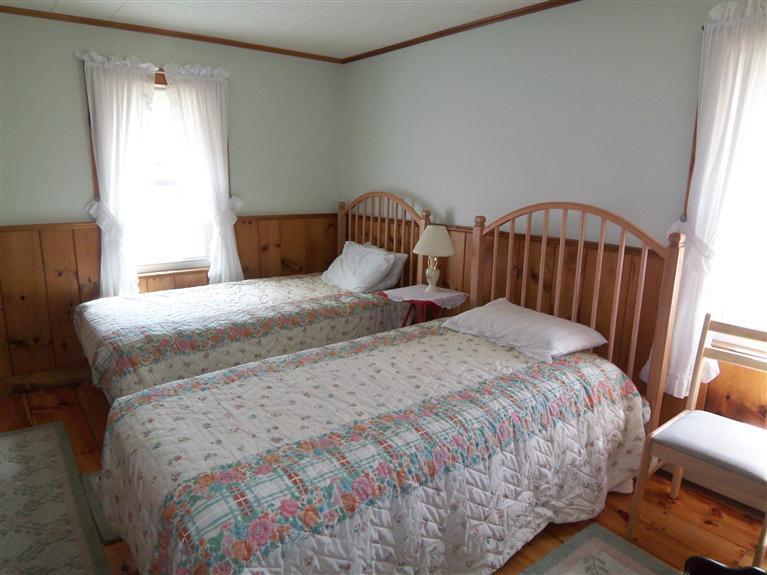 28 Manderville Road West Harwich, MA 02671 - Photo 6 of 18 a large bed sitting in a bedroom next to a window