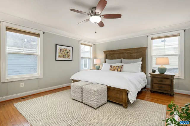 a bedroom with a bed lamp closet and window