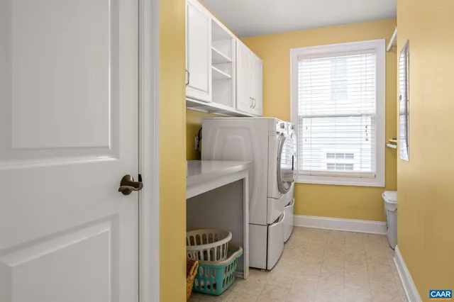 a bathroom with a tub sink and a window