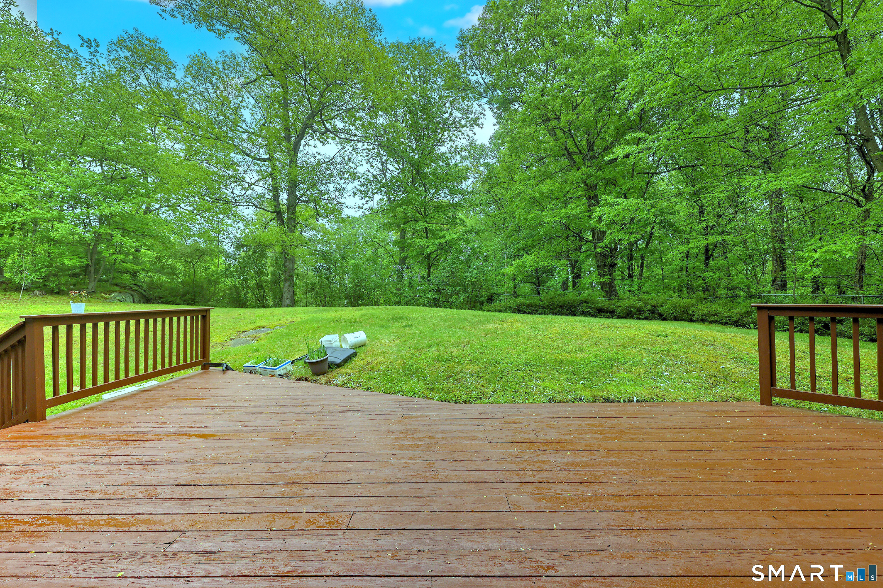 125 Peck Hill Road Woodbridge, CT 06525 - Photo 2 of 40 a view of a deck with a yard