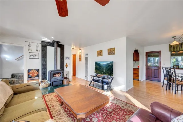 a view of a dining room with furniture and a chandelier