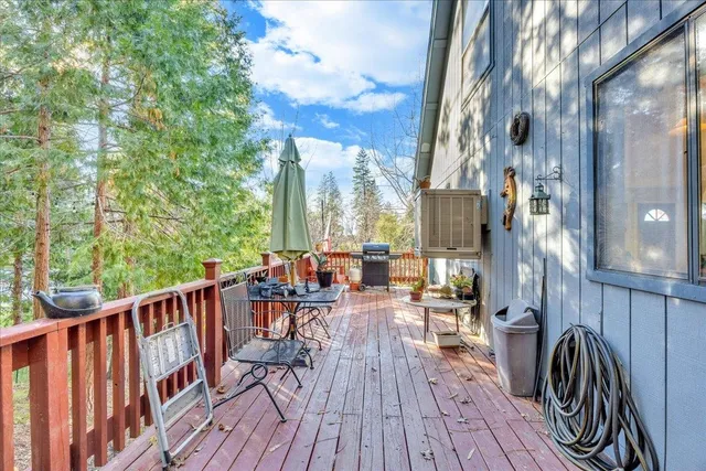 a view of balcony with chairs and wooden fence