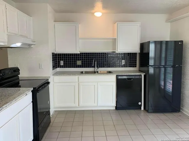 a utility room with washer and dryer