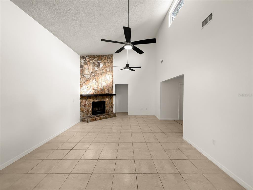 1610 Harbor Way Bartow, FL 33830 - Photo 15 of 25 a view of empty room with a ceiling fan and window