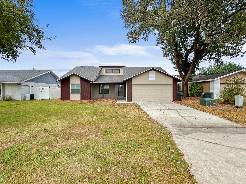 1610 Harbor Way Bartow, FL 33830 - Photo 2 of 25 a front view of a house with a garden