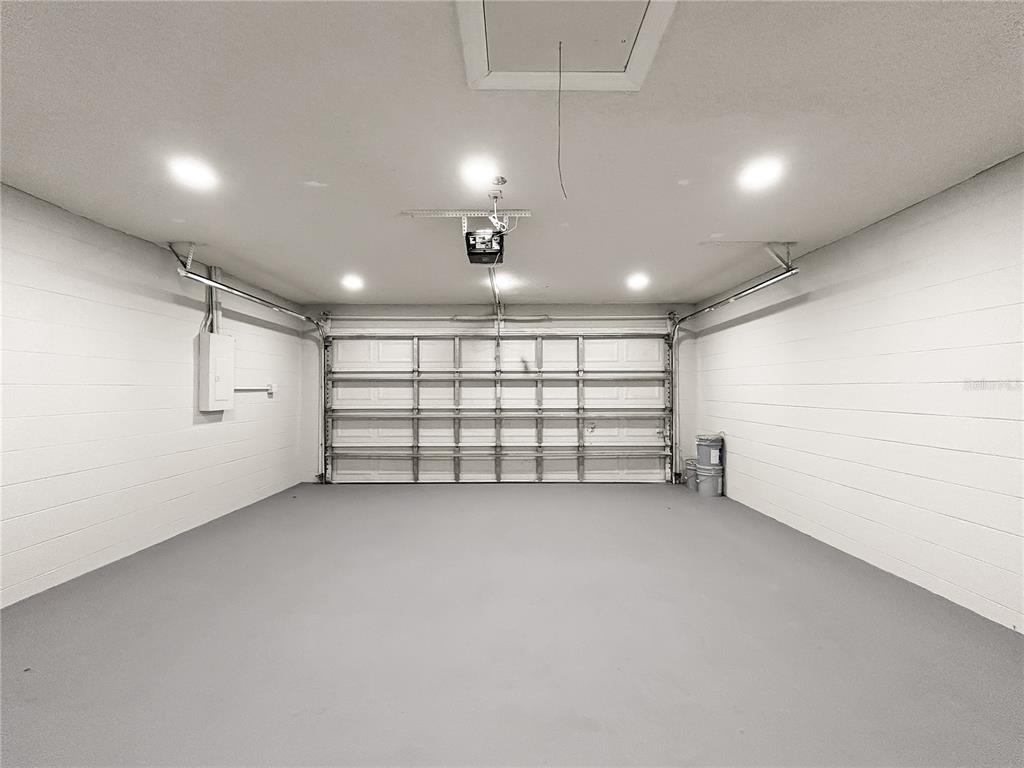 1610 Harbor Way Bartow, FL 33830 - Photo 23 of 25 an empty room with white walls and chandelier fan