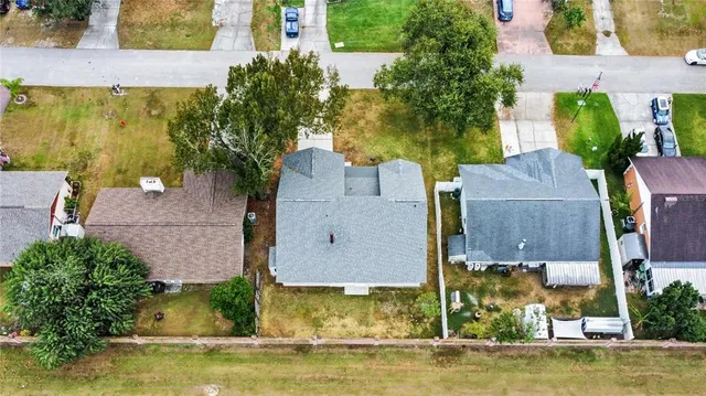 an aerial view of a house with a swimming pool