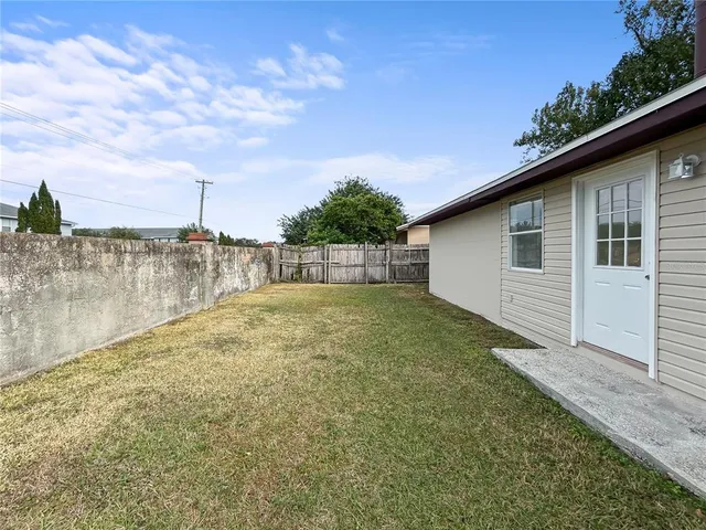 a backyard of a house with lots of green space