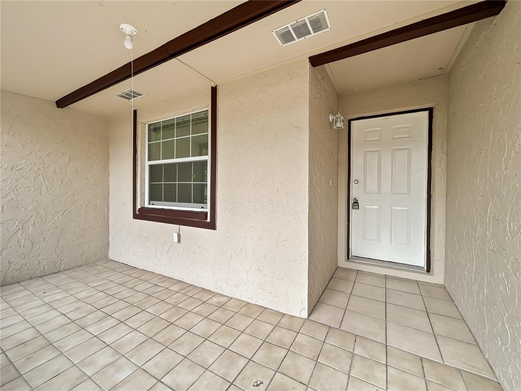 1610 Harbor Way Bartow, FL 33830 - Photo 8 of 25 a view of an empty room with windows