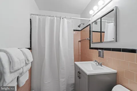 a kitchen with cabinets appliances and a sink