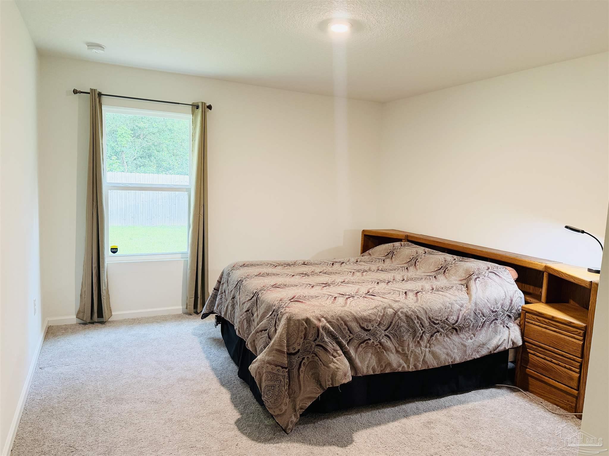 1625 Addies Way Pensacola, FL 32534 - Photo 40 of 50 a bedroom with a bed and closet