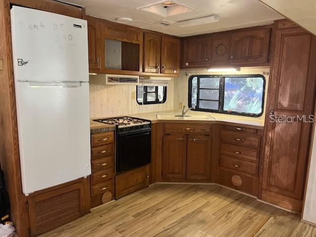 3000 Clarcona Road, Unit 445 Apopka, FL 32703 - Photo 12 of 13 a kitchen with stainless steel appliances granite countertop a refrigerator and a stove