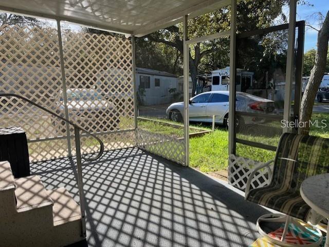 3000 Clarcona Road, Unit 445 Apopka, FL 32703 - Photo 6 of 13 a view of a chairs and table in the patio