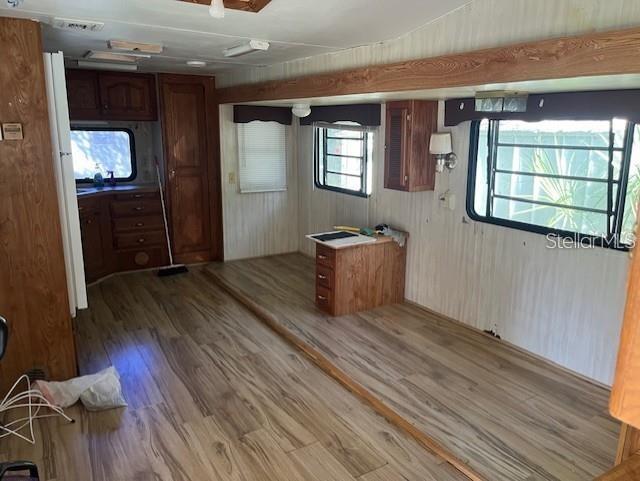 3000 Clarcona Road, Unit 445 Apopka, FL 32703 - Photo 7 of 13 a living room with furniture and a wooden floor