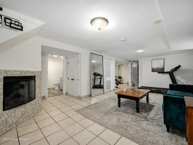 a view of a livingroom with furniture and a fireplace
