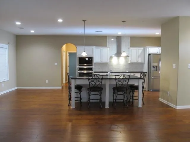 a kitchen with a table and chairs in it