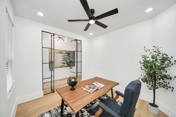 a workspace with furniture and a potted plant