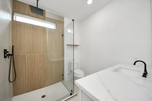 a bathroom with a sink and a shower