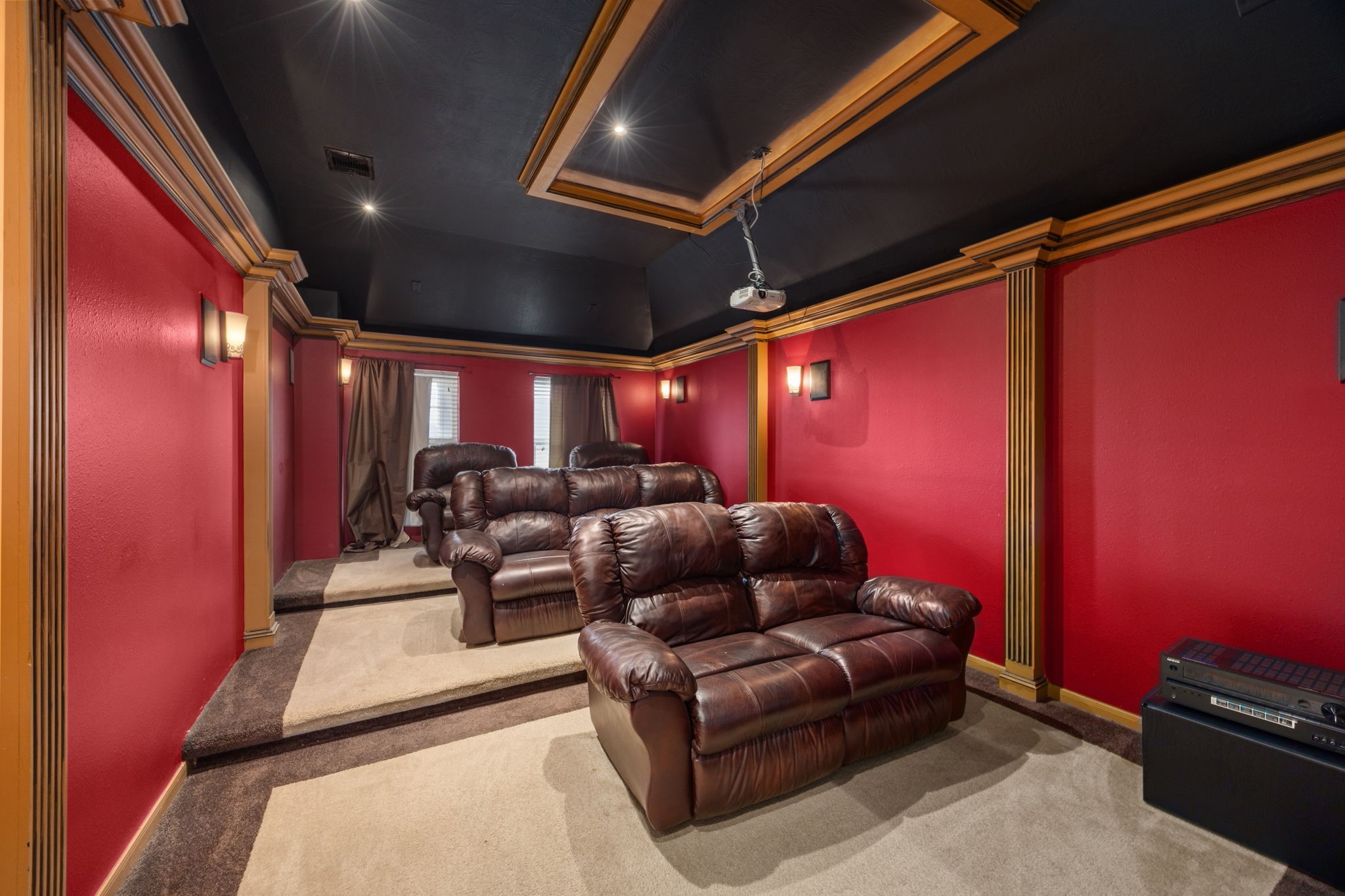 6719 Latchmore Lane Houston, TX 77049 - Photo 37 of 46 a media room with lots of chairs and a projector