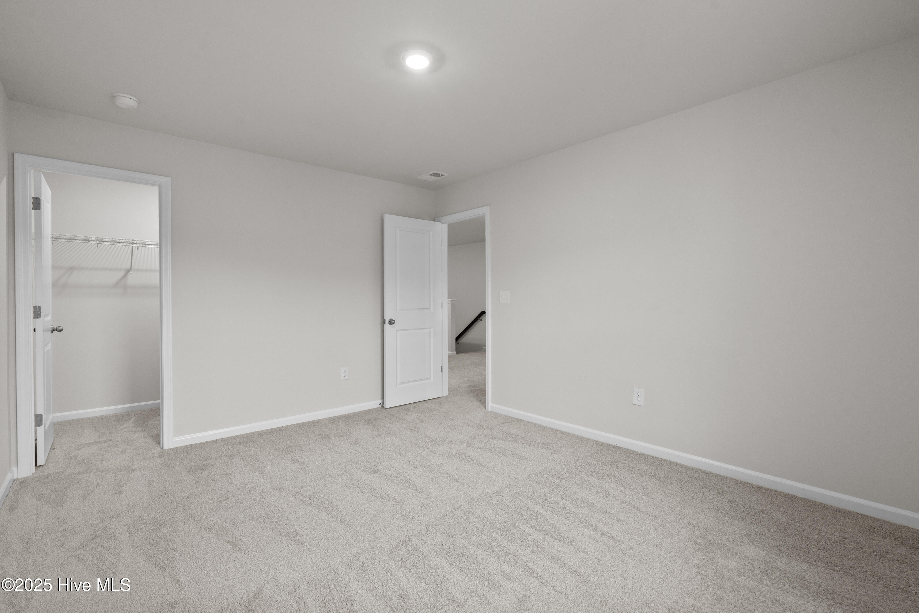 826 Palm Frond Way Calabash, NC 28467 - Photo 19 of 35 Upstairs bedroom showing walk in closet